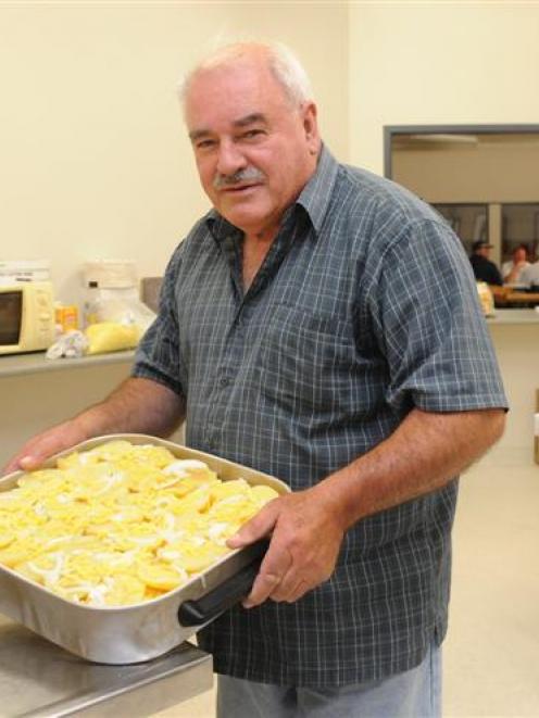 Neil Gamble, Dunedin Ice Stadium manager, in the kitchen cooking for the curling competitors....