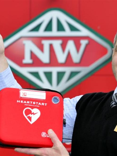 New World Centre City Dunedin manager Tony Watts with one of the defibrillators that are mapped...