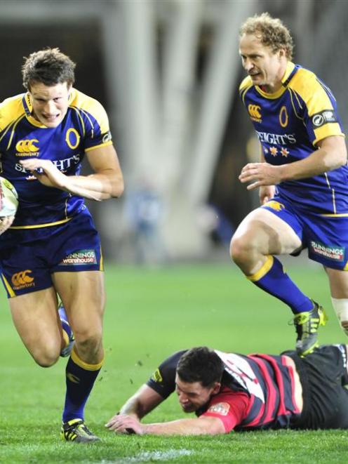 Otago fullback Glenn Dickson (left) goes on the charge against Canterbury at Forsyth Barr Stadium...