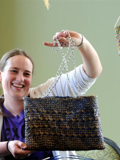 Otago University summer school weaving student Annabelle Molloy celebrates the completion of her...