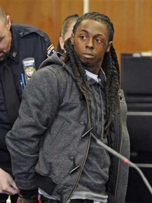 lil wayne with his hair cut in jail