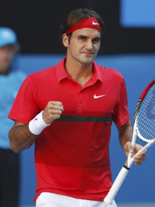 Roger Federer of Switzerland celebrates after defeating Juan Martin Del Potro of Argentina in...