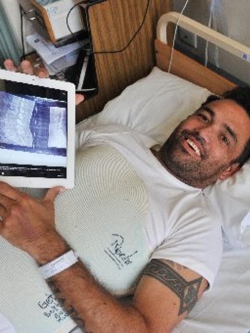 Rueben Skipper recuperates in Dunedin Hospital after shattering a vertebra while bodyboarding at...