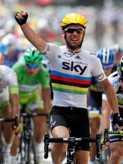 Sky Procycling rider Mark Cavendish of Britain celebrates winning the second stage of the 99th...