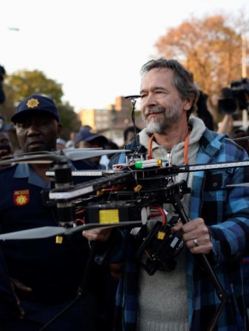 South African police detain film-maker F.C. Hamman after he used a radio-controlled helicopter...