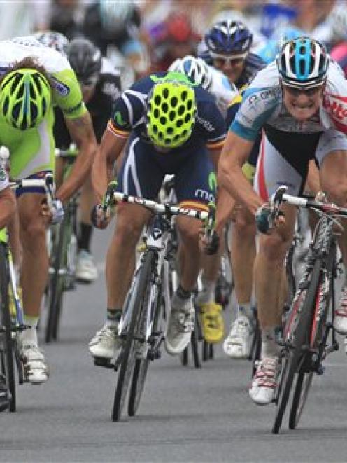 Stage winner Andre Greipel of Germany, foreground right, and second place Mark Cavendish of...
