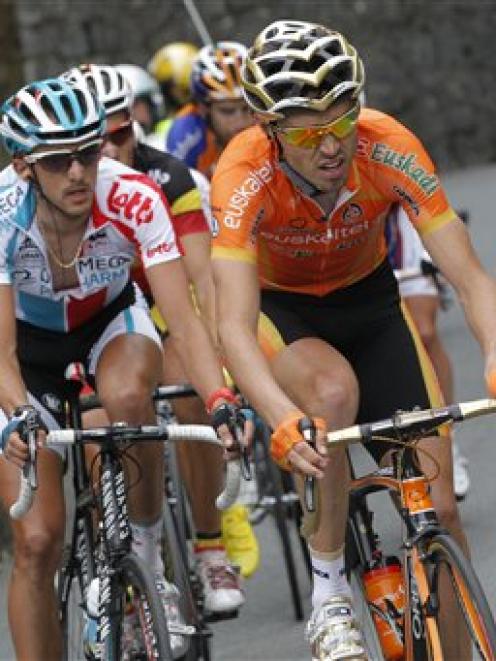 Stage winner Samuel Sanchez of Spain, right, and second place Jelle Vanendert of Belgium, left,...