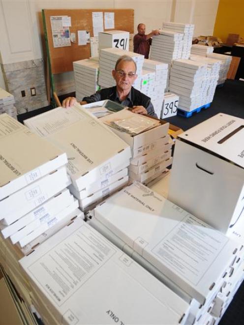 Statistics New Zealand area manager Bryan Bishop examines a stack of census forms in Dunedin...