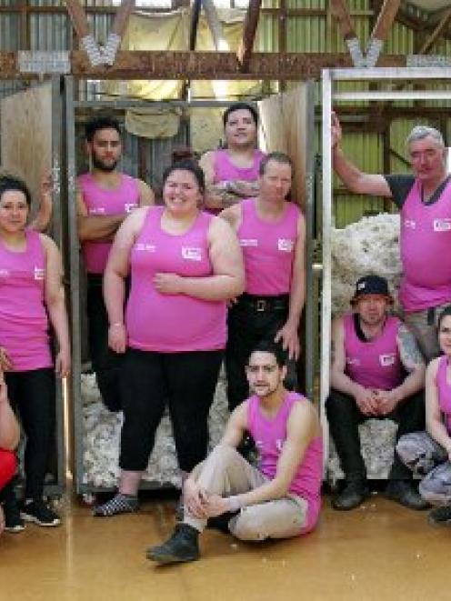 Supporting cancer awareness in the Stonehenge woolshed are (standing, from left) Kelly Luke, ...