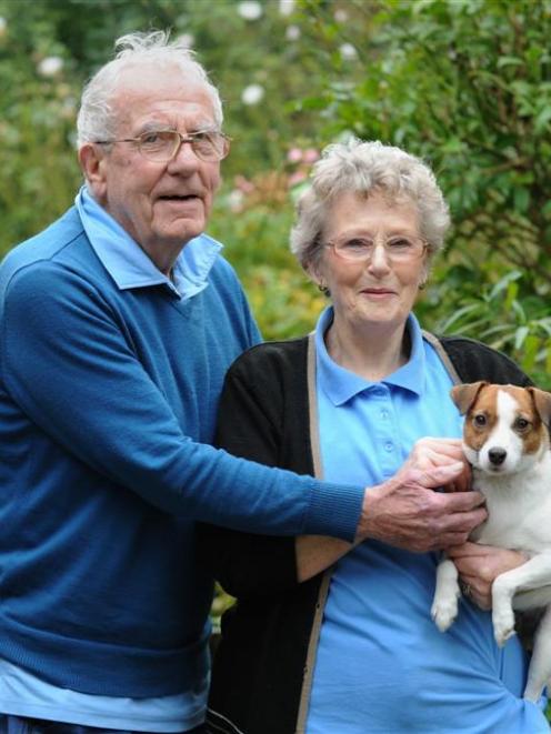 Swimming coach Punch Tremaine, wife Dorothy and dog Lulu at their Mosgiel home. Photo by Peter...