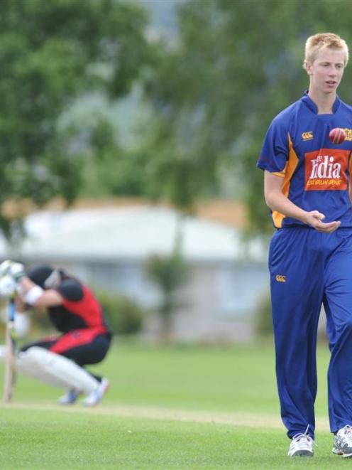 Taieri's  Jack Hunter (right) prepares to bowl to Black Caps captain Brendon McCullum in a...