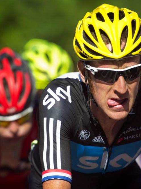 Team Sky rider Bradley Wiggins of Britain (R) cycles with BMC Racing Team rider Cadel Evans of...