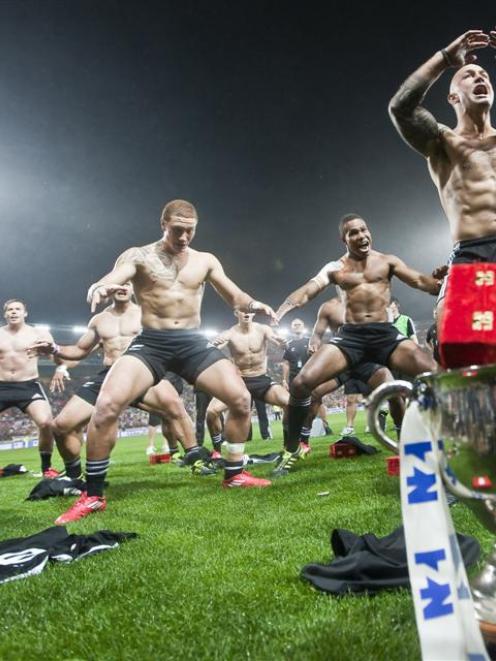 The New Zealand team does the haka to celebrate winning the final of the 2011 Wellington Sevens...