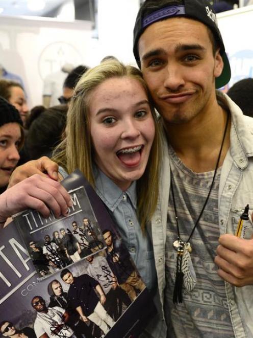 Titanium fan Tayla Anderson, of Dunedin, snuggles up to band member Jordi Webber.