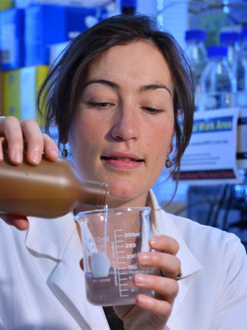 University of Otago researcher Dr Sara Hanning pours  a liquid intended to counter ''dry mouth''....