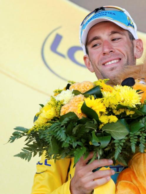 Vincenzo Nibali celebrates on the podium after winning the 197.5km 13th stage of the Tour de...