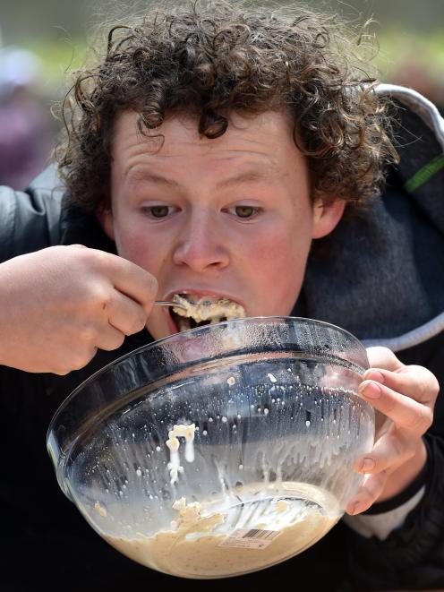 Leevi Hanson (12), of Dunedin, ploughs through a bowl of porridge in the Speed Porridge Eating...