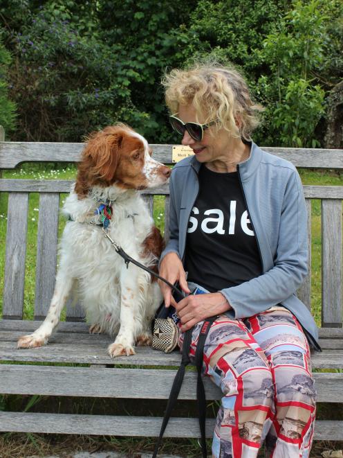 Madeleine Child with her clever dog Gaucho take a rest during their walk in their `spot' in the...