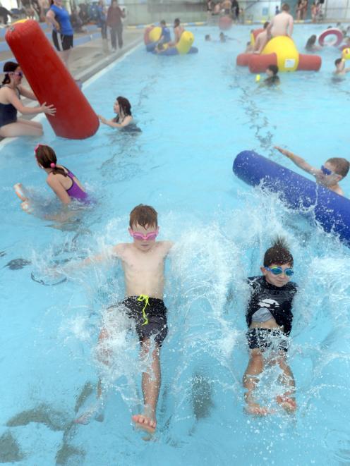 Mosgiel brothers Jay (9, left) and Jackson (6) Carter play at the Mosgiel pool on its final day...