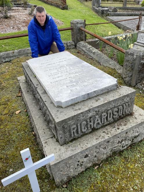 Dunedin military historian Peter Trevathan visits the grave of Major the Honorable Sir John...