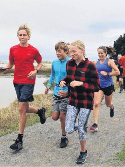 Foot traffic . . . Runners head off to negotiate the trail along the river banks during the Ramble.