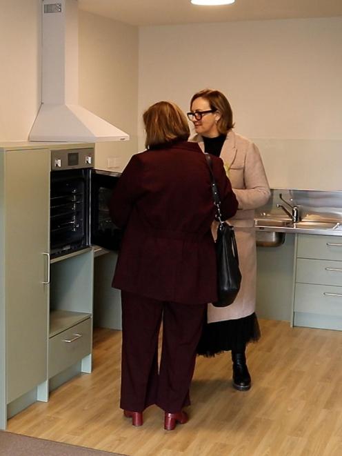 Kainga Ora regional director Liz Krause (left) and Housing Minister Megan Woods inspect a kitchen...