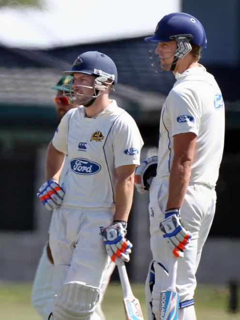 Wells (right) chats to team-mate Derek de Boorder during a Plunket Shield game in Napier in the...