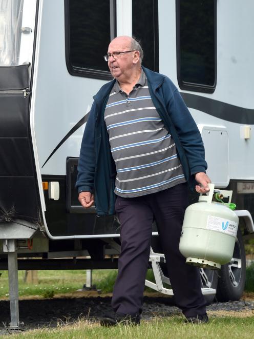 Luxury caravan owner Trevor Greeves packs up his camp site. 