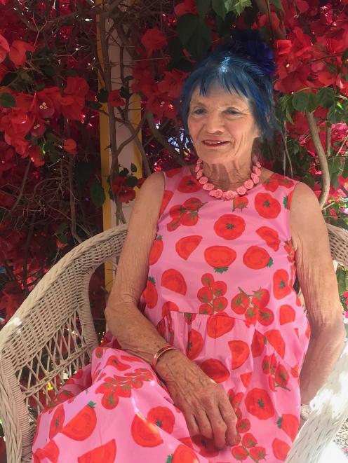 Giant’s House owner Josie Martin’s dress complements bougainvillea "Scarlett O’Hara". 