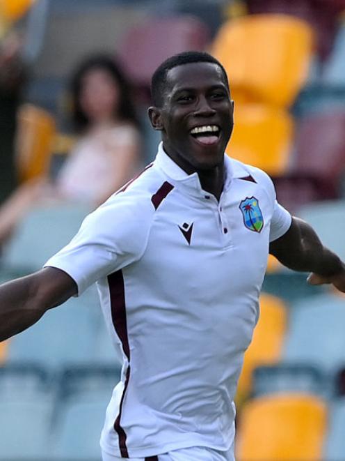 West Indies quick Shamar Joseph celebrates his side’s victory in the second test against...