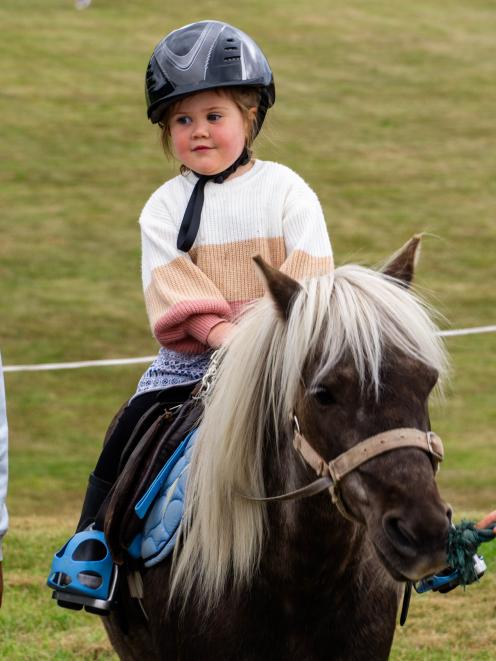 Elderflower Maguire, 3, of Palmerston, rides a pony for the first time at the Palmerston A&P Show.