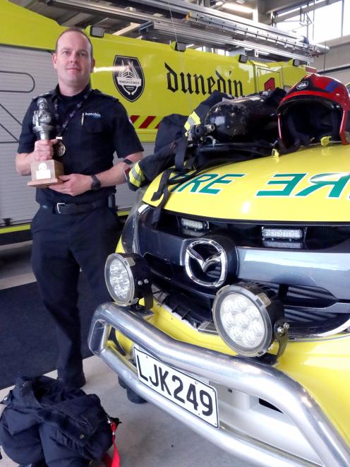 Dunedin Airport Emergency Services blue watch chief Clint Hagan shows his kit, weighing about...