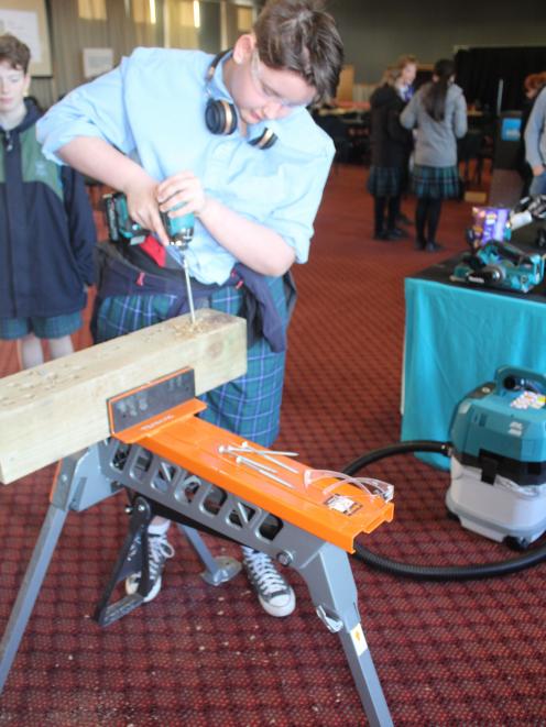Blue Mountain College pupil Madi Haack-Rangi, 15, puts a power drill into action at the Girls in...