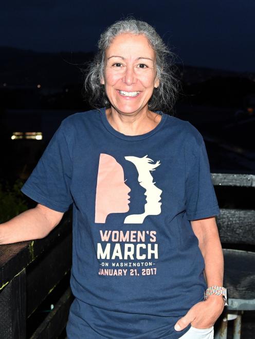 American expat Amy Witter, wearing her "Women’s March" T-shirt, says she is worried about the...