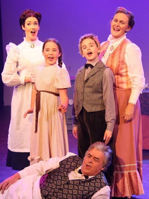 Mary Poppins leads (from left) Kayla Wilcox, Carter Mitchell, 12, Lucas Miller, 12, Jane Stuart...