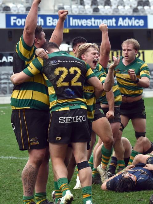 Green Island players celebrate victory on Saturday.