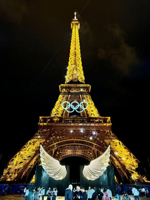 The Eiffel Tower, adorned with the Olympics Rings, illuminated during the opening ceremony of the...