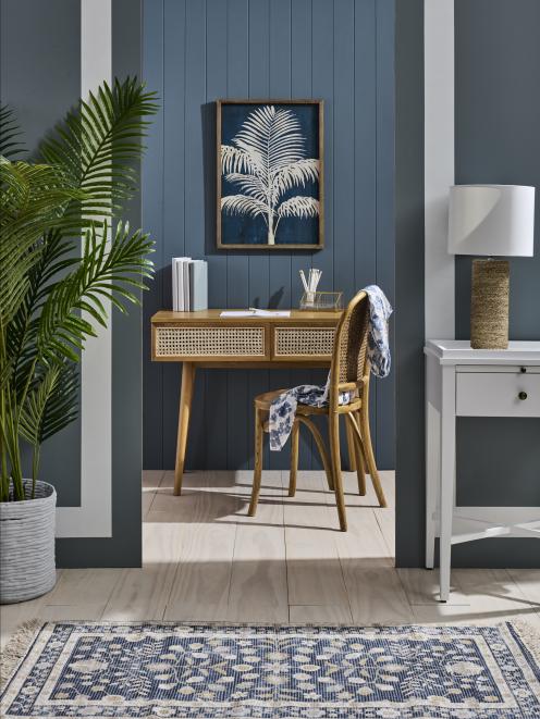 Soothing blues create a calming, creative space. The tongue-and-groove back wall is painted in...