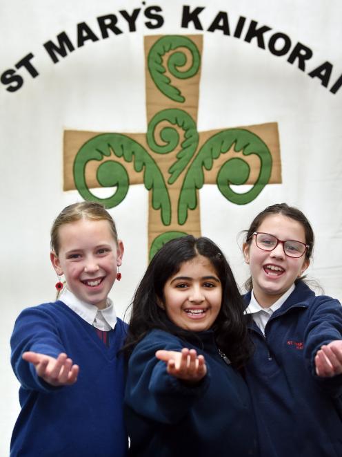 St Mary’s Kaikorai School pupils (from left) Ngaika Rapsey, Olivia Reju and Alyssa Kubala sing...