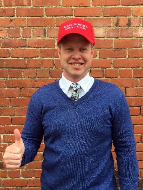 Great stuff ... Campbell and  Sons managing director Clark  Campbell models a cap pro moting the campaign to get  an aquatic facility in Mosgiel.  PHOTOS: SHAWN MCAVINUE