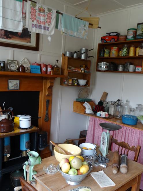 A historic New Zealand kitchen and living area is a feature of the Taieri Historical Museum and...