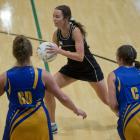 Southern centre Grace Herdman looks for options as Taieri players Lucy Geddes (left) and Rachel...