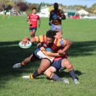 Kurow’s Tyler Burgess (left) holds up Athletic Marist’s Paea Fifita as he attempts to score...