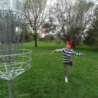 Oamaru-based Eli Ferguson, 6, tries out disc golf on the opening day at Weston Domain with his...