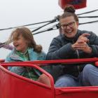 Megan Graham and her daughter, Jodie (8), enjoy the Octopus ride at the 105th Winton A&P Show....