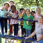 Smiling together for the 100th anniversary of the Kelsey Yaralla Kindergarten building are (from...