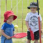 Hunter (2) and Leo (3) Brazier, of Dunedin, get competitive during a brotherly game of tetherball...