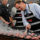 Meat and greet . . . National Party leader John Key minds the lamb at the Upper Clutha A and P...