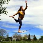 University of Otago anthropology student Michelle Henderson relaxes on a tightrope at the North...