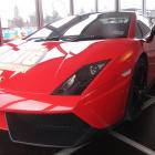 A bright red Lamborghini Gallardo is on offer for people to admire in Queenstown as part of the ...